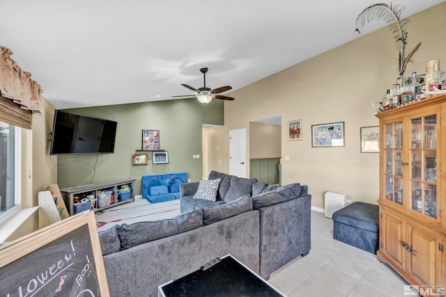 living room featuring ceiling fan and light tile patterned floors