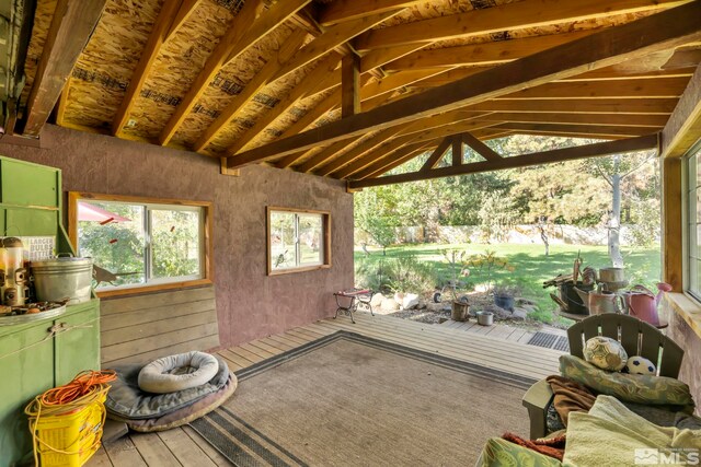 unfurnished sunroom with vaulted ceiling