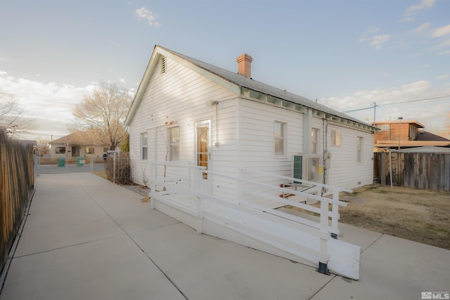 view of side of home featuring a patio area