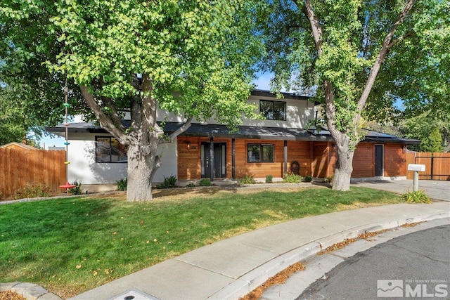 view of front of home with a front lawn