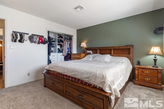 bedroom featuring light carpet