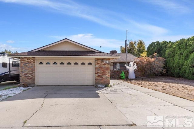 ranch-style home featuring a garage