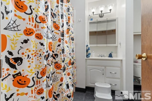 bathroom featuring vanity, curtained shower, and tile patterned flooring