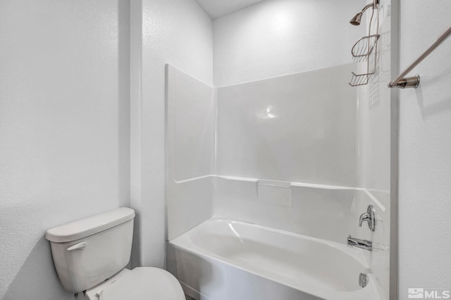 bathroom featuring toilet and bathtub / shower combination