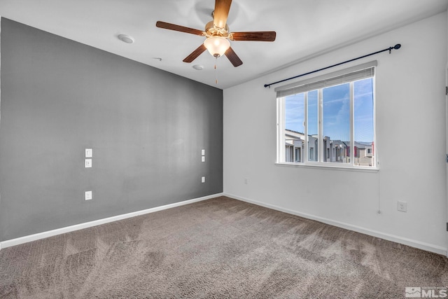 spare room with carpet flooring and ceiling fan