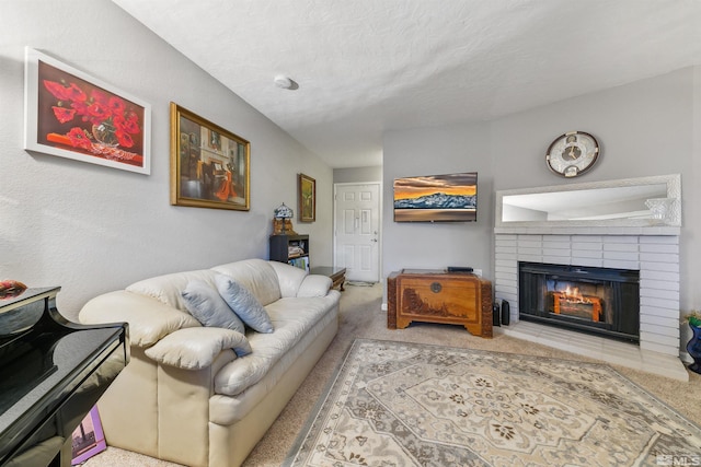 carpeted living room featuring a textured ceiling