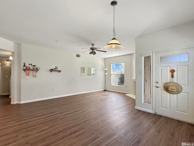 entrance foyer featuring ceiling fan and dark wood-type flooring