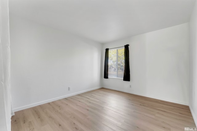 spare room featuring light hardwood / wood-style floors