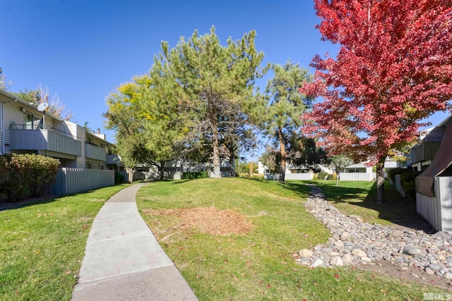 view of yard featuring a balcony