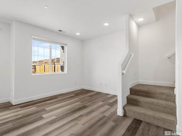 staircase featuring hardwood / wood-style flooring