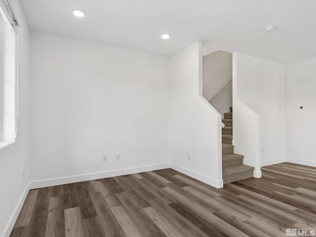 spare room featuring dark hardwood / wood-style flooring