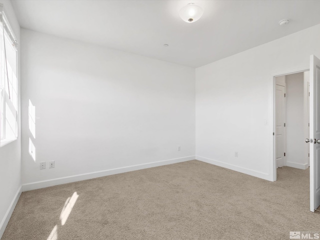 spare room with light colored carpet