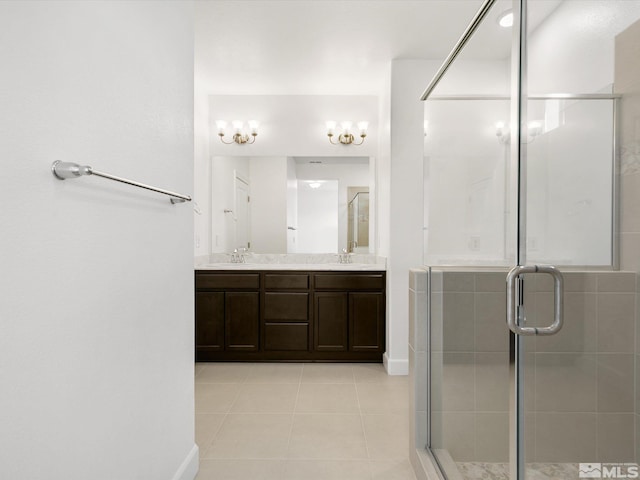 bathroom with vanity, walk in shower, and tile patterned flooring