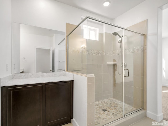 bathroom with vanity and an enclosed shower