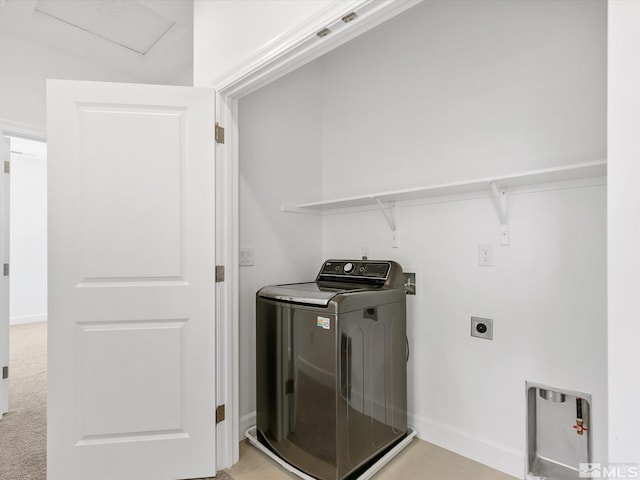 laundry room with washer / dryer and light carpet