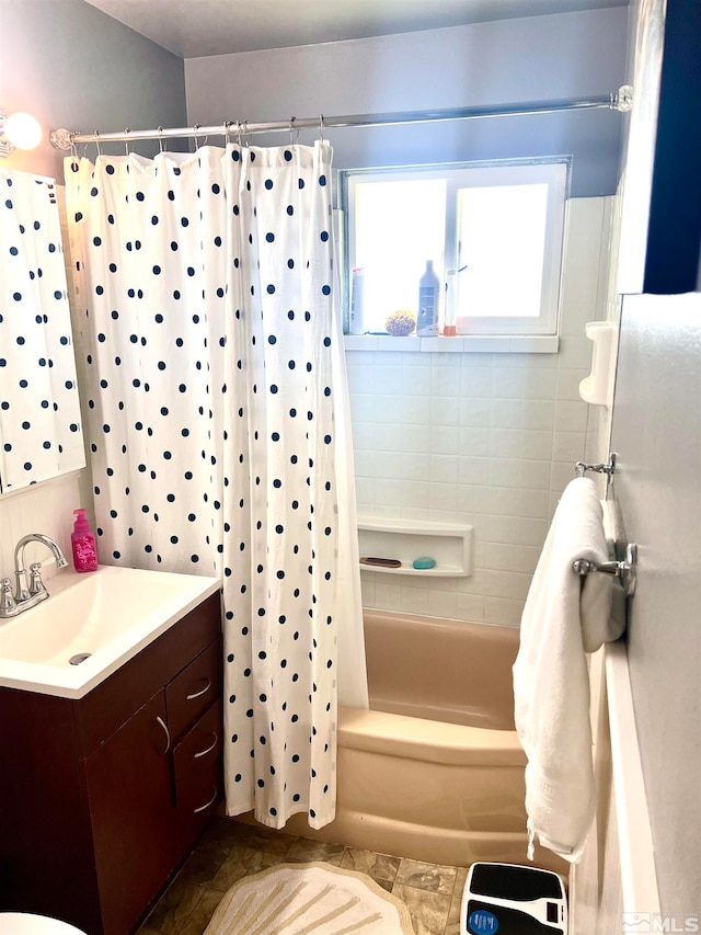 bathroom featuring vanity and shower / bath combo