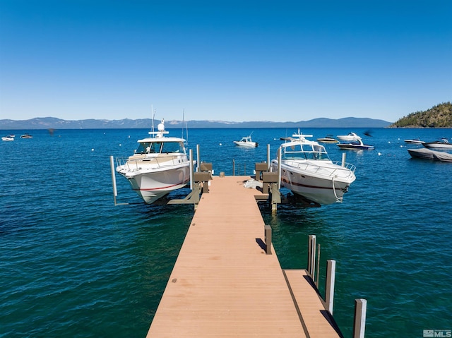 dock area with a water and mountain view