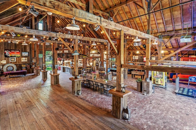 miscellaneous room with wood ceiling, hardwood / wood-style floors, beam ceiling, and high vaulted ceiling