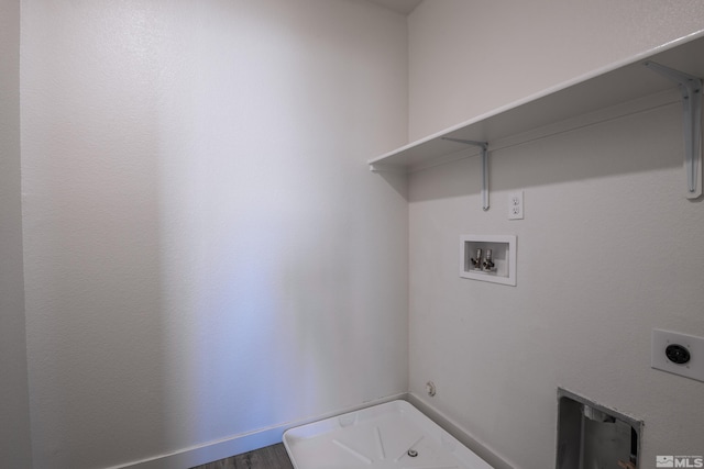 laundry area featuring hookup for an electric dryer, hardwood / wood-style floors, and washer hookup