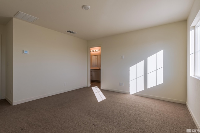 empty room with carpet flooring