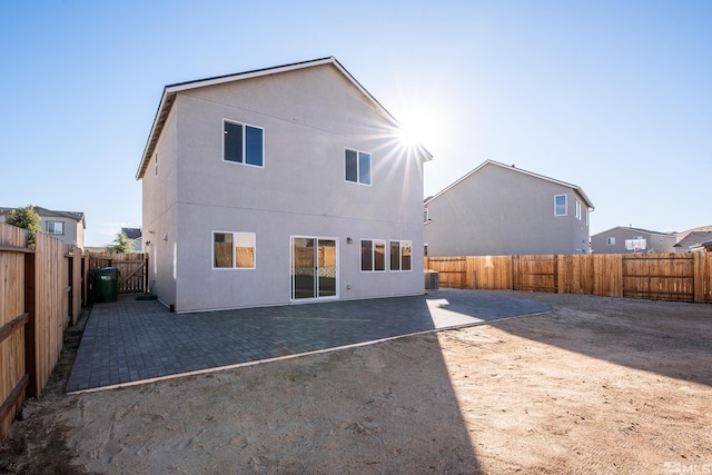 back of house featuring a patio area and central AC