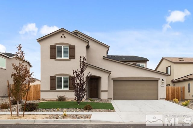 view of front of property with a garage