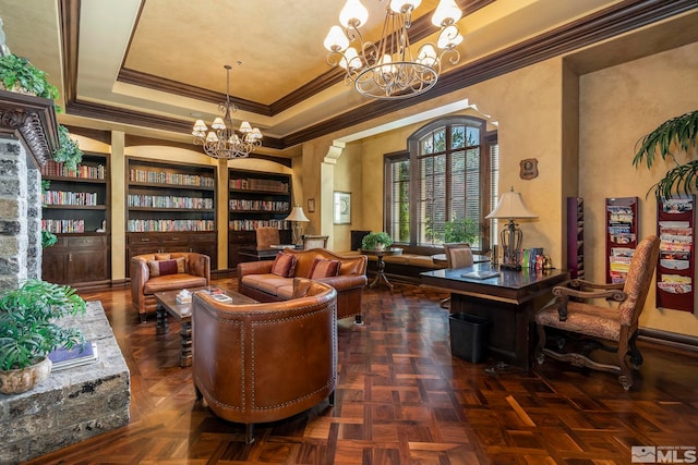 living area featuring built in features, an inviting chandelier, and dark parquet flooring