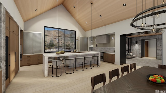 kitchen with high vaulted ceiling, light hardwood / wood-style flooring, a center island, and wooden ceiling