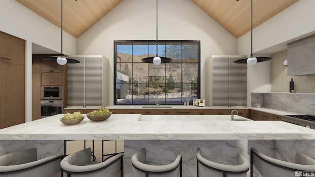 kitchen featuring stainless steel double oven, high vaulted ceiling, pendant lighting, sink, and wooden ceiling