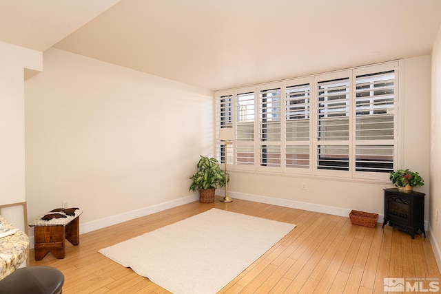 sitting room with hardwood / wood-style flooring