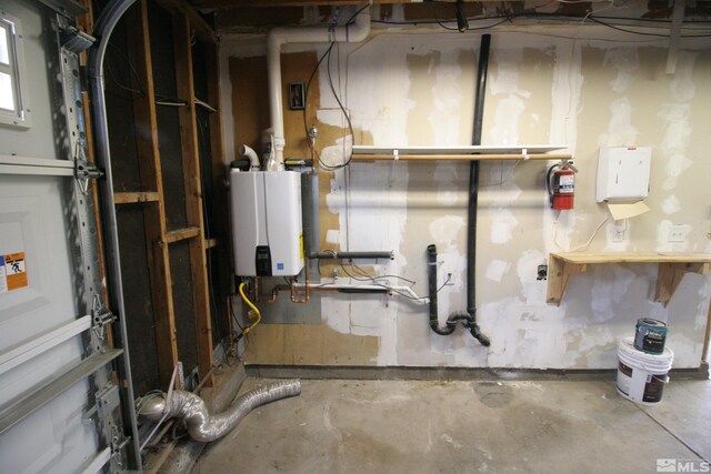 utility room featuring water heater