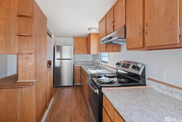 kitchen featuring sink, light hardwood / wood-style flooring, and stainless steel appliances