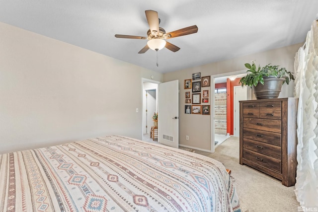 bedroom featuring light colored carpet and ceiling fan
