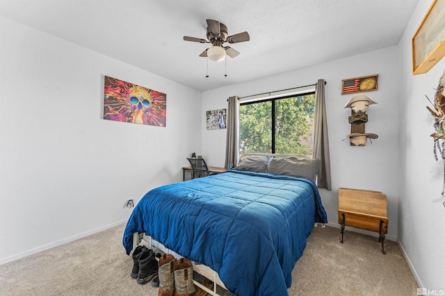 bedroom with light carpet and ceiling fan