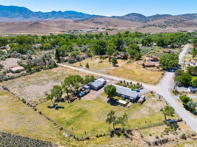 birds eye view of property featuring a mountain view