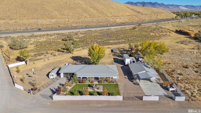 birds eye view of property featuring a mountain view