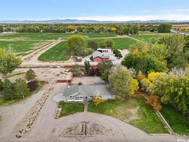 drone / aerial view featuring a mountain view and a rural view