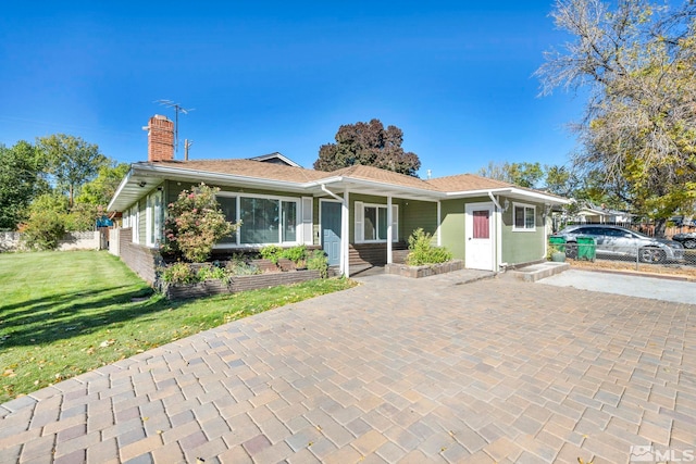 ranch-style home with a front yard