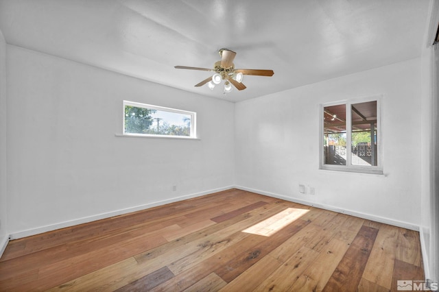 spare room featuring light hardwood / wood-style floors and ceiling fan