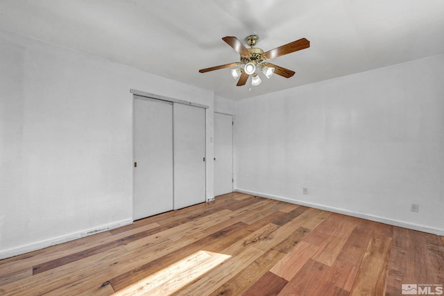 unfurnished bedroom with light hardwood / wood-style floors and ceiling fan