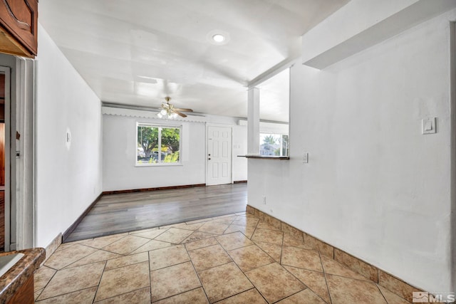 interior space with light hardwood / wood-style floors and ceiling fan