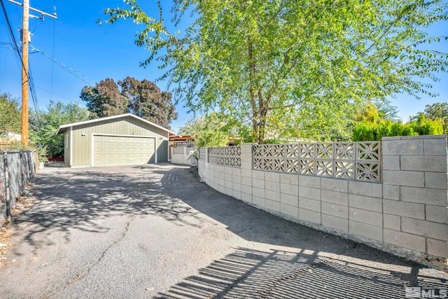 exterior space with an outdoor structure and a garage