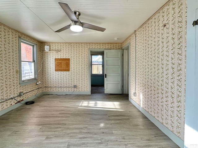 unfurnished room featuring ceiling fan and light hardwood / wood-style flooring