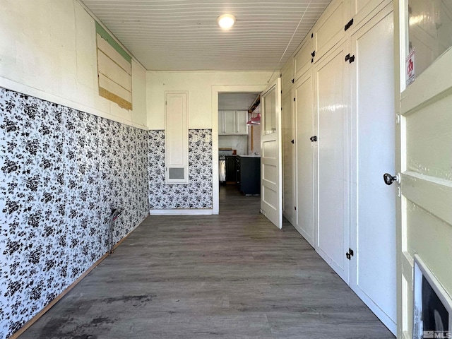 corridor featuring dark hardwood / wood-style flooring