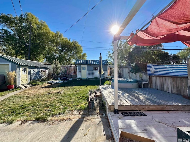 view of yard featuring a hot tub, a storage shed, and a deck