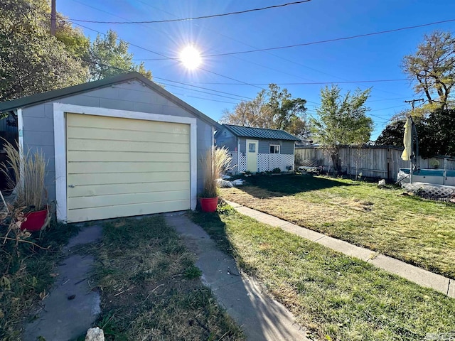 garage with a lawn