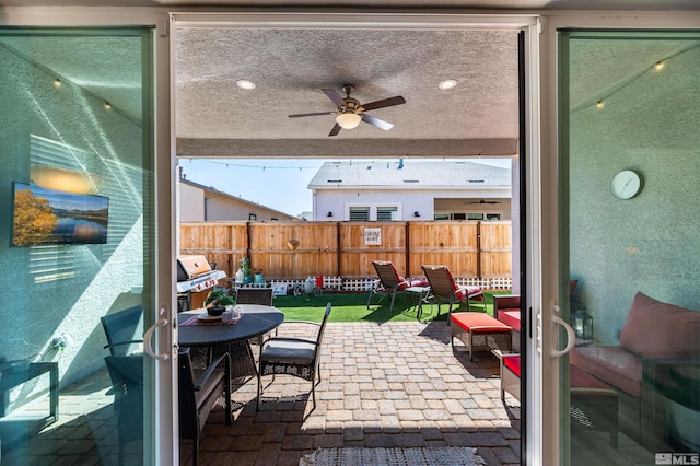 view of patio / terrace featuring grilling area and ceiling fan