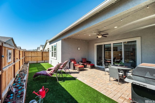 view of patio / terrace with an outdoor living space, a grill, and ceiling fan