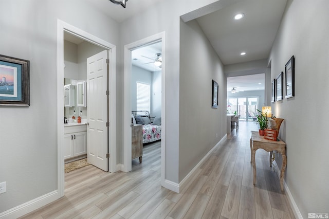 hall with light wood-type flooring