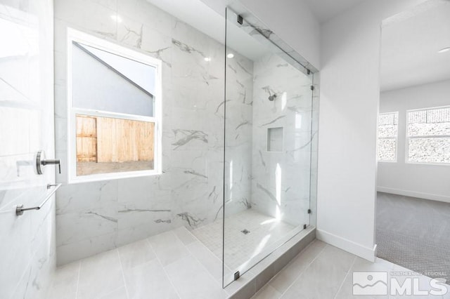 bathroom featuring a tile shower